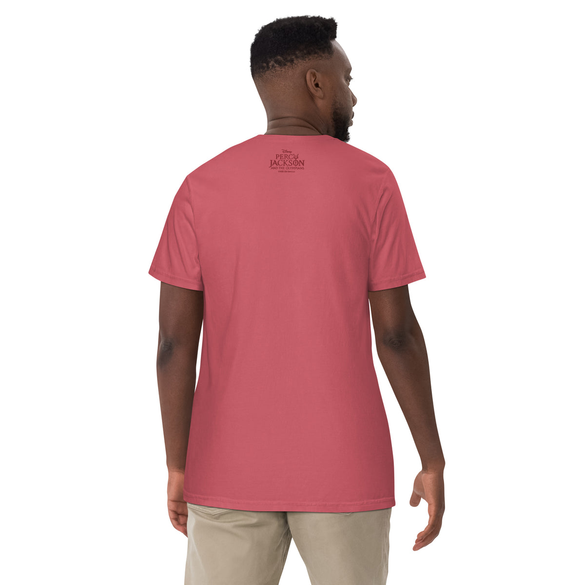 Folded stack of watermelon pink Percy Jackson Hephaestus t-shirts